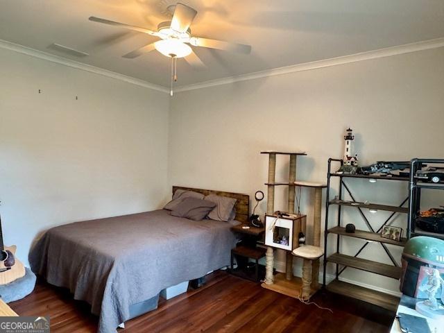 360 Morgan Mill Rd, Brooks, GA 30205 - bedroom with wood finished floors, ornamental molding, and ceiling fan