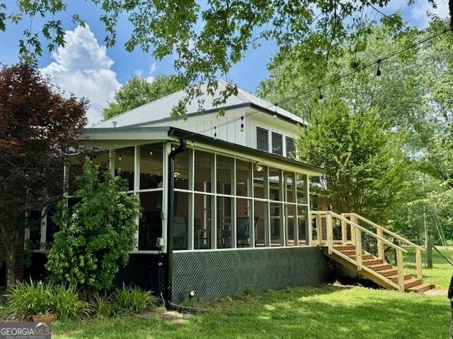 360 Morgan Mill Rd, Brooks, GA 30205 - view of side of home featuring a sunroom and a lawn