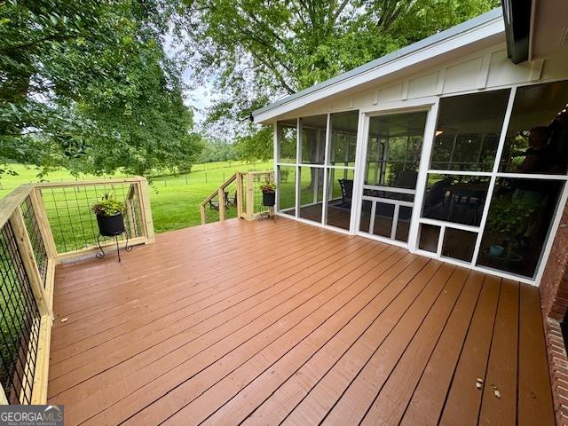 360 Morgan Mill Rd, Brooks, GA 30205 - wooden terrace with a sunroom and a lawn