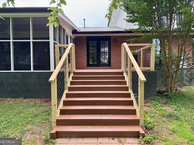 360 Morgan Mill Rd, Brooks, GA 30205 - property entrance featuring brick siding and a metal roof