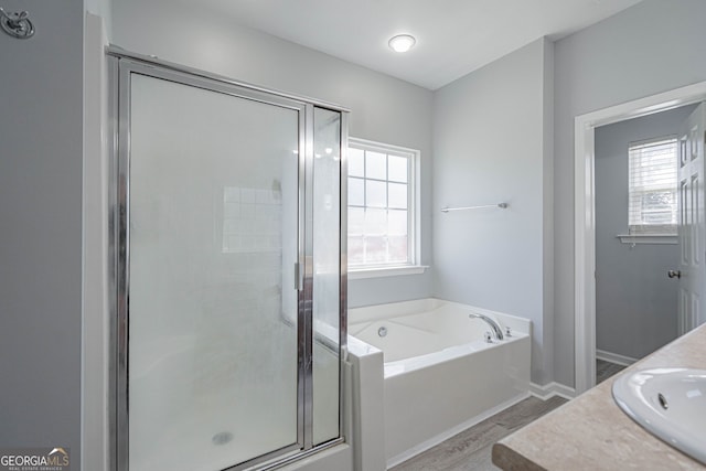 231 Cyane Ln, Guyton, GA 31312 - bathroom featuring a bath, a shower stall, plenty of natural light, and vanity