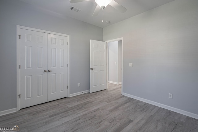 231 Cyane Ln, Guyton, GA 31312 - unfurnished bedroom featuring wood finished floors, a closet, and a ceiling fan