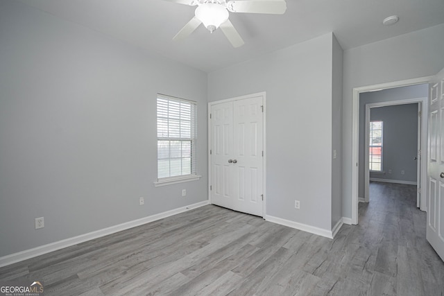 231 Cyane Ln, Guyton, GA 31312 - unfurnished bedroom featuring wood finished floors, a closet, and a ceiling fan