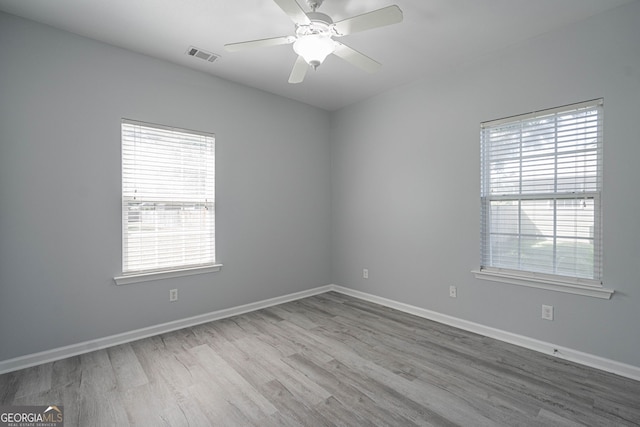 231 Cyane Ln, Guyton, GA 31312 - empty room with wood finished floors and a ceiling fan