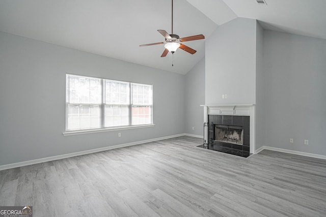 231 Cyane Ln, Guyton, GA 31312 - unfurnished living room with ceiling fan, wood finished floors, a fireplace, and high vaulted ceiling