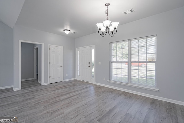 231 Cyane Ln, Guyton, GA 31312 - entryway with a chandelier and wood finished floors