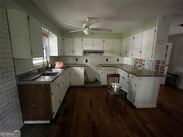 15 Liberty St, Gainesville, GA 30501 - kitchen with dark wood-style floors, under cabinet range hood, and tasteful backsplash