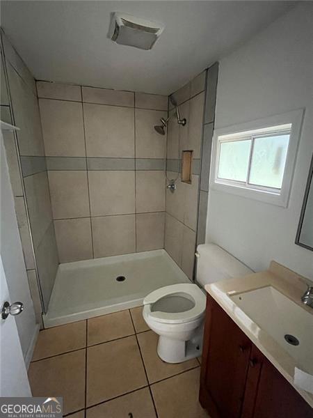 15 Liberty St, Gainesville, GA 30501 - bathroom with vanity, tile patterned floors, and tiled shower