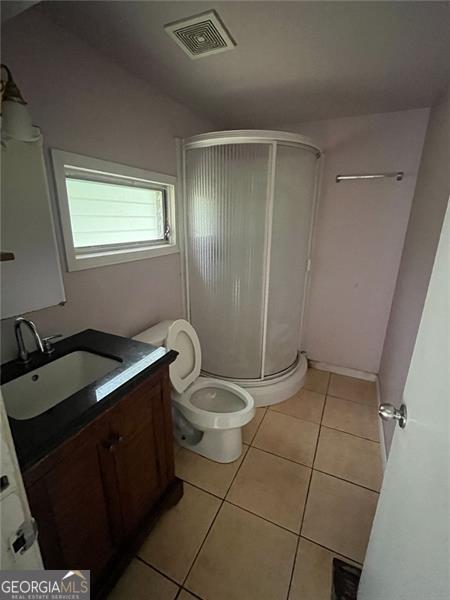 15 Liberty St, Gainesville, GA 30501 - full bath featuring vanity, tile patterned floors, and a shower stall