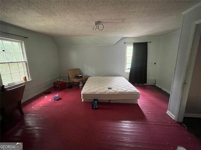 15 Liberty St, Gainesville, GA 30501 - bedroom with a textured ceiling, vaulted ceiling, and wood finished floors