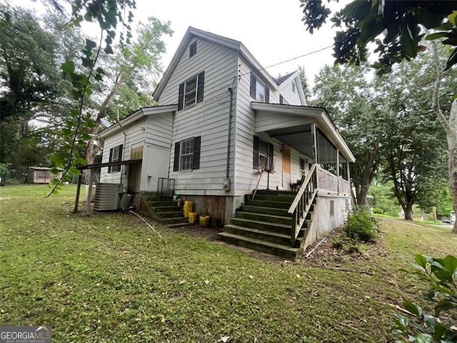 15 Liberty St, Gainesville, GA 30501 - view of home's exterior featuring stairs, a lawn, and covered porch