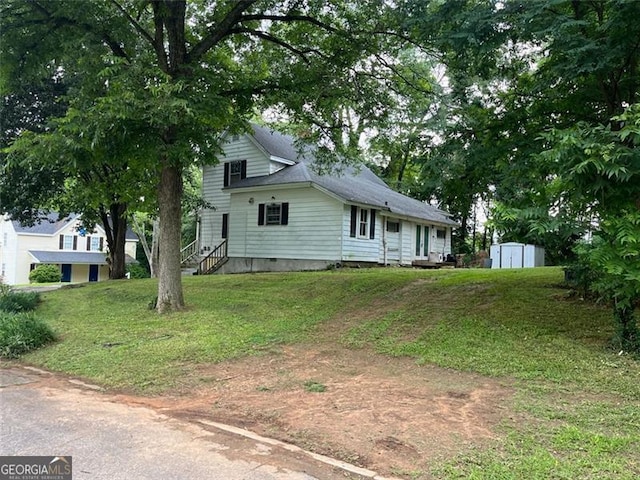 15 Liberty St, Gainesville, GA 30501 - view of front of property with a shed and a front lawn