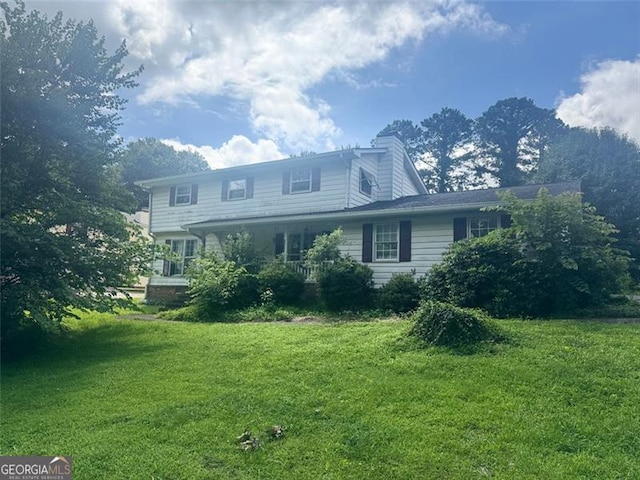 713 Pine Chase, Lawrenceville, GA 30043 - view of front facade featuring a front yard and a chimney