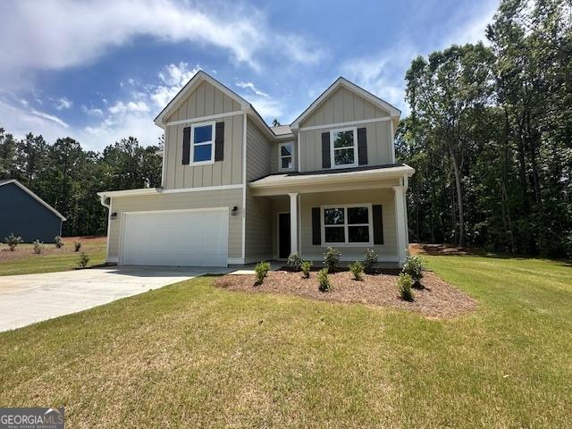 202 Lakeside Dr Lot 73, Lagrange, GA 30240 - view of front of property with driveway, a garage, a front yard, board and batten siding, and a porch