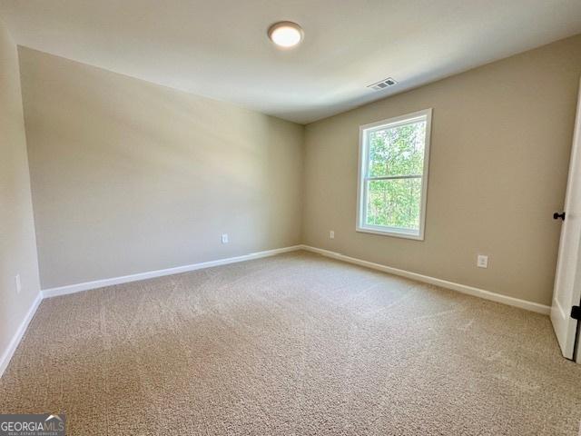 202 Lakeside Dr Lot 73, Lagrange, GA 30240 - spare room featuring baseboards and carpet floors