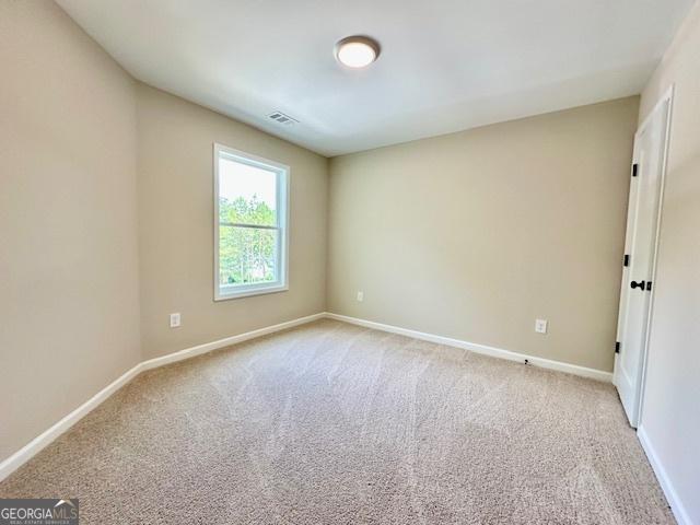 202 Lakeside Dr Lot 73, Lagrange, GA 30240 - empty room with light colored carpet and baseboards