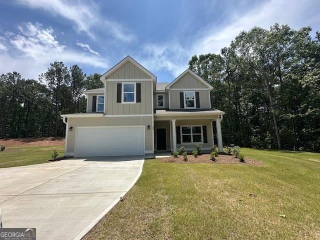 202 Lakeside Dr Lot 73, Lagrange, GA 30240 - craftsman-style home featuring concrete driveway, an attached garage, board and batten siding, and a front yard