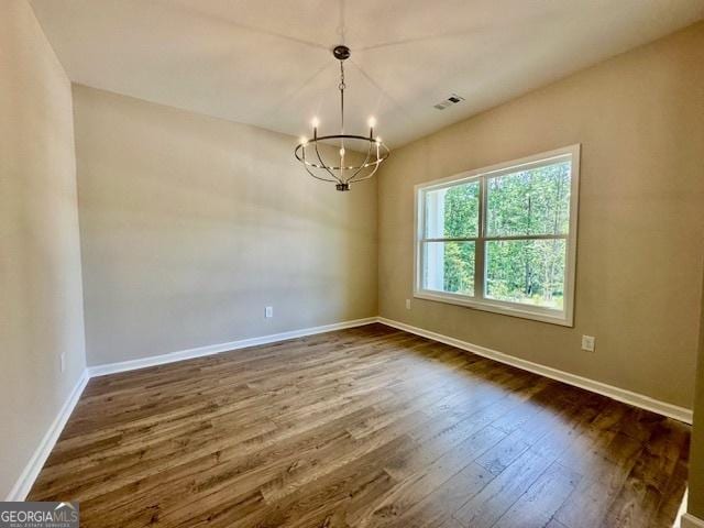 202 Lakeside Dr Lot 73, Lagrange, GA 30240 - empty room with a chandelier and dark wood finished floors