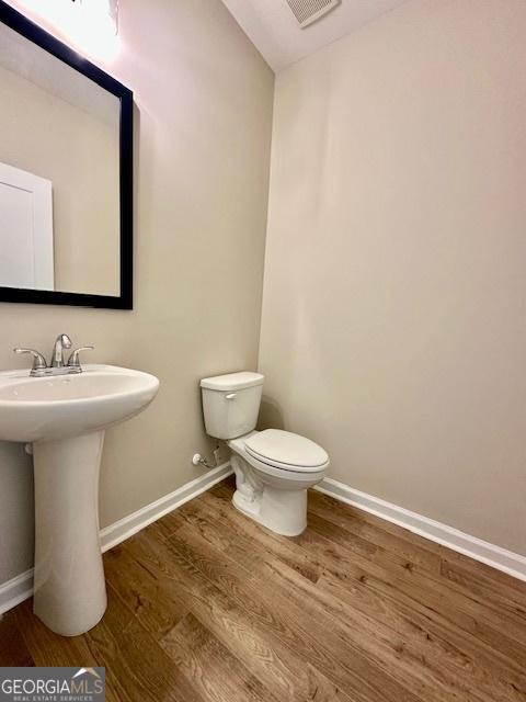 202 Lakeside Dr Lot 73, Lagrange, GA 30240 - half bathroom featuring wood finished floors and toilet