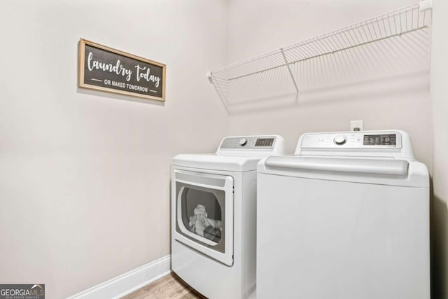 2326 Britt St, Grayson, GA 30017 - laundry area featuring independent washer and dryer and light wood-type flooring