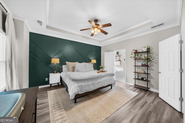 2653 W Main St NW, Atlanta, GA 30318 - bedroom with a raised ceiling, wood finished floors, crown molding, multiple windows, and ceiling fan