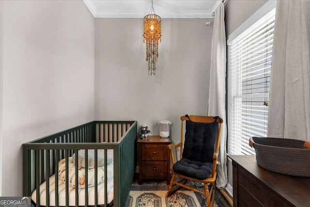 2653 W Main St NW, Atlanta, GA 30318 - bedroom featuring crown molding and a nursery area