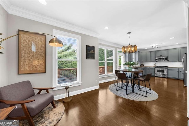 2653 W Main St NW, Atlanta, GA 30318 - dining room featuring dark wood finished floors, crown molding, a chandelier, and recessed lighting