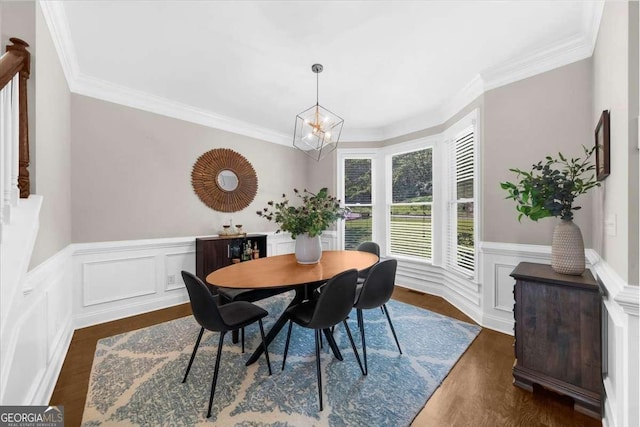 2653 W Main St NW, Atlanta, GA 30318 - dining area with ornamental molding, dark wood-type flooring, a chandelier, wainscoting, and a decorative wall