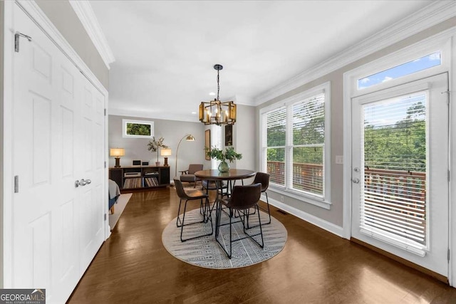 2653 W Main St NW, Atlanta, GA 30318 - dining room with crown molding, dark wood-style floors, and a chandelier