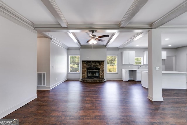370 Simms Rd, Carrollton, GA 30117 - unfurnished living room with coffered ceiling, a ceiling fan, dark wood-style flooring, beam ceiling, and a fireplace