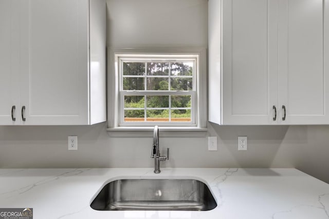 370 Simms Rd, Carrollton, GA 30117 - kitchen with white cabinetry and light stone counters