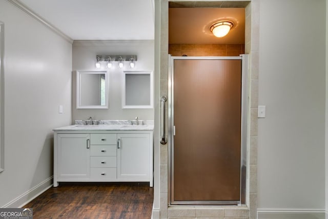 370 Simms Rd, Carrollton, GA 30117 - full bath featuring double vanity, a shower stall, wood finished floors, and crown molding