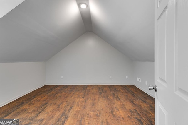 370 Simms Rd, Carrollton, GA 30117 - additional living space featuring lofted ceiling and dark wood-type flooring