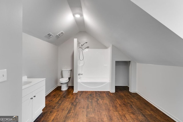 370 Simms Rd, Carrollton, GA 30117 - bathroom featuring vanity, lofted ceiling, wood finished floors, and tub / shower combination