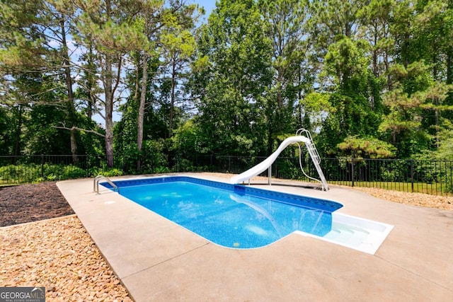 370 Simms Rd, Carrollton, GA 30117 - view of pool with a water slide, a patio area, and a fenced backyard