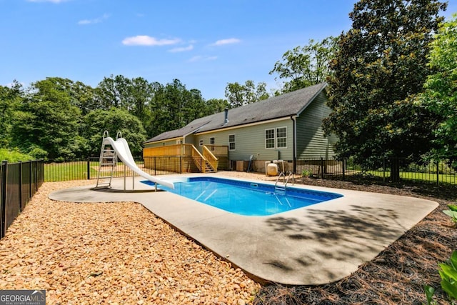 370 Simms Rd, Carrollton, GA 30117 - view of pool with a water slide, stairs, a fenced backyard, a wooden deck, and a patio area