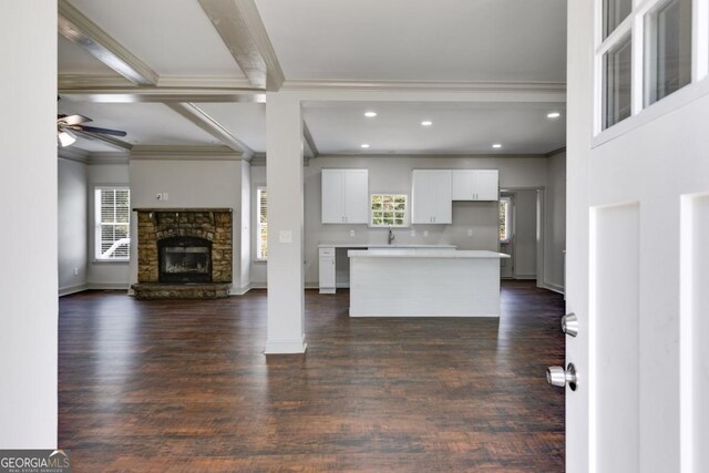 370 Simms Rd, Carrollton, GA 30117 - kitchen featuring ornamental molding, plenty of natural light, open floor plan, white cabinets, and light countertops