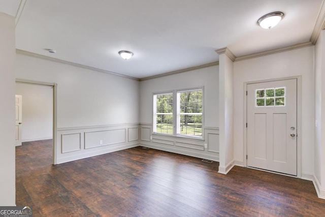 370 Simms Rd, Carrollton, GA 30117 - entryway with healthy amount of natural light, dark wood finished floors, ornamental molding, and a wainscoted wall