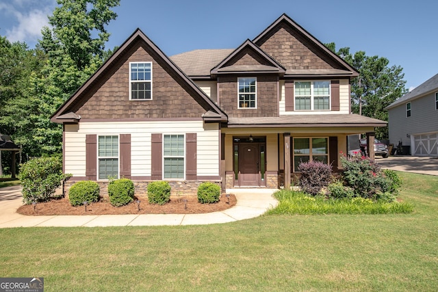 38 Pin Oak Way, Hamilton, GA 31811 - craftsman inspired home with stone siding, a front yard, and a porch