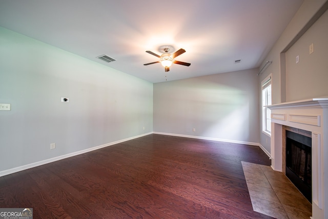 38 Pin Oak Way, Hamilton, GA 31811 - unfurnished living room featuring ceiling fan, wood finished floors, and a tile fireplace