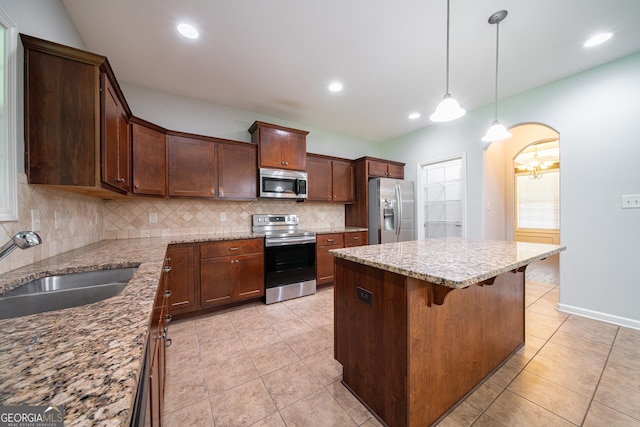 38 Pin Oak Way, Hamilton, GA 31811 - kitchen featuring stainless steel appliances, tasteful backsplash, a center island, light tile patterned floors, and recessed lighting