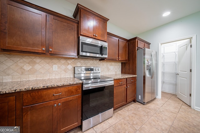 38 Pin Oak Way, Hamilton, GA 31811 - kitchen featuring appliances with stainless steel finishes, tasteful backsplash, light stone countertops, and recessed lighting