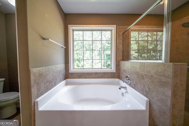 38 Pin Oak Way, Hamilton, GA 31811 - bathroom featuring a bath, tile walls, and a shower
