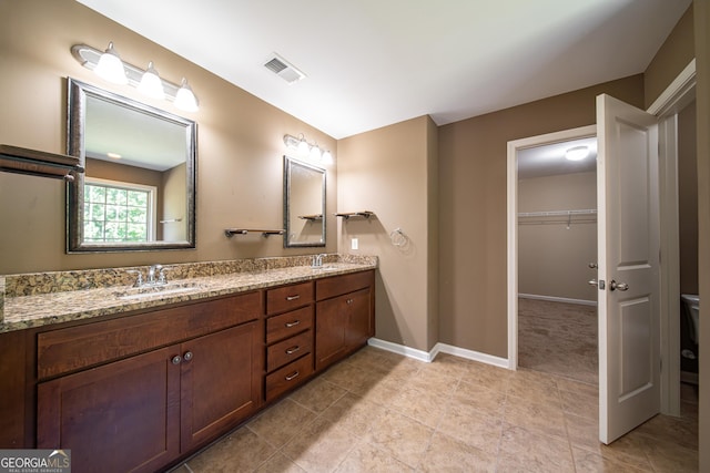 38 Pin Oak Way, Hamilton, GA 31811 - full bath with double vanity, tile patterned flooring, and a spacious closet
