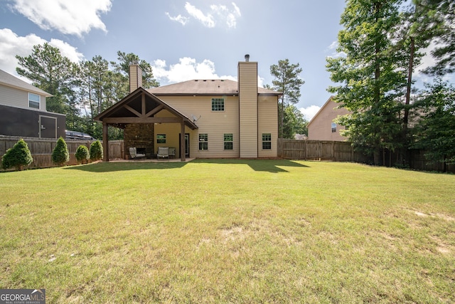 38 Pin Oak Way, Hamilton, GA 31811 - back of house with a chimney, a fenced backyard, and a patio