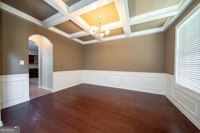 38 Pin Oak Way, Hamilton, GA 31811 - empty room with coffered ceiling, a chandelier, dark wood-type flooring, plenty of natural light, and beamed ceiling