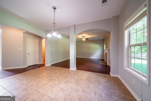 38 Pin Oak Way, Hamilton, GA 31811 - tiled empty room featuring arched walkways and a ceiling fan