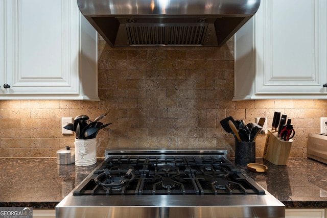 4 Bluff Ct SE, Cartersville, GA 30120 - kitchen with ventilation hood, stove, decorative backsplash, and white cabinetry