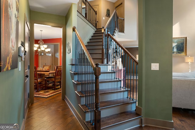 4 Bluff Ct SE, Cartersville, GA 30120 - staircase featuring hardwood / wood-style floors and a chandelier