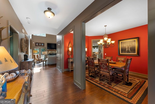 4 Bluff Ct SE, Cartersville, GA 30120 - dining room with a chandelier and dark wood-style floors